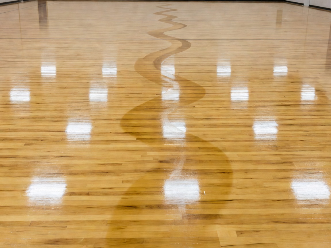 Freshly cleaned indoor court showing a clear floor-care path